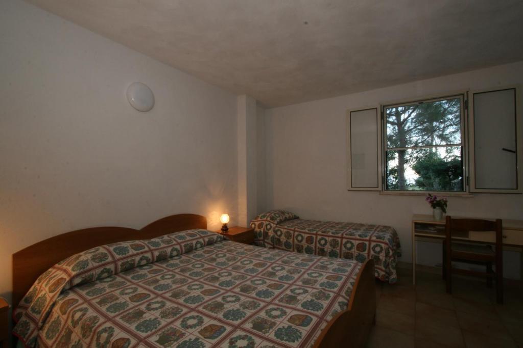 Hotel Club Poseidon Stalettì Rum bild